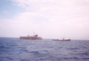Tugboat Ziad towing working barge
